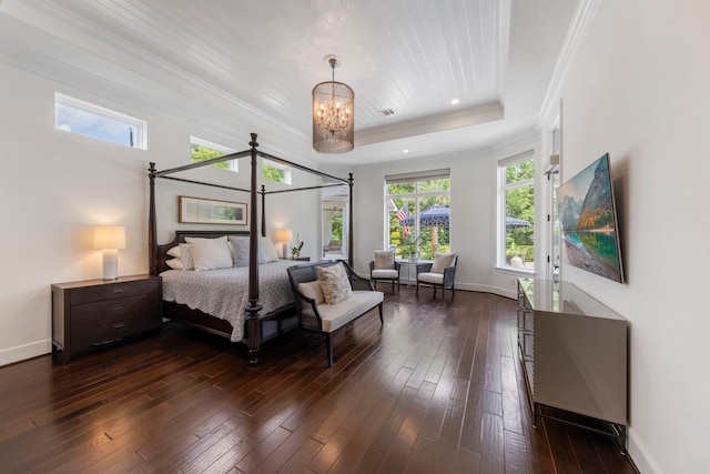 8550 Tombron Grove Rd, Magnolia, TX 77354 - bedroom featuring a raised ceiling, crown molding, a chandelier, and dark wood-style flooring