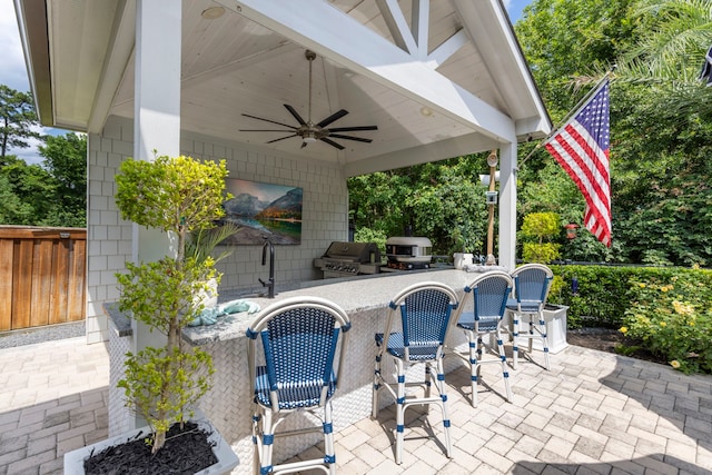 8550 Tombron Grove Rd, Magnolia, TX 77354 - view of patio featuring exterior kitchen and a ceiling fan
