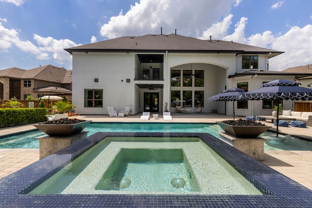 8550 Tombron Grove Rd, Magnolia, TX 77354 - view of swimming pool featuring french doors, a patio, an outdoor hangout area, and a pool with connected hot tub