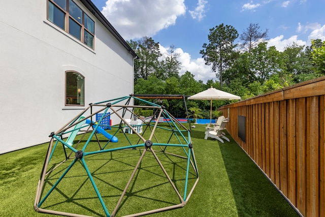 8550 Tombron Grove Rd, Magnolia, TX 77354 - view of yard with a playground and a pool