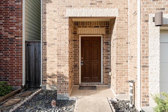 3736 Main Poplar Dr, Houston, TX 77025 - doorway to property featuring brick siding