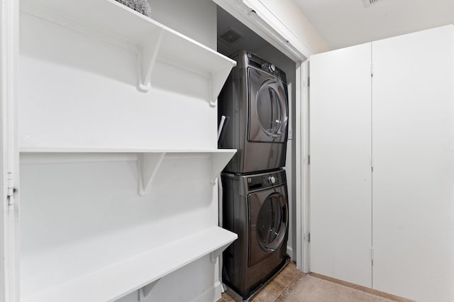 3736 Main Poplar Dr, Houston, TX 77025 - laundry area featuring stacked washer / dryer