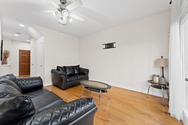 3736 Main Poplar Dr, Houston, TX 77025 - living room featuring a ceiling fan, wood finished floors, and recessed lighting