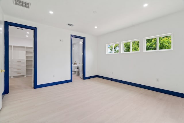 7831 Sandy St, Houston, TX 77028 - empty room with light wood-style floors and recessed lighting