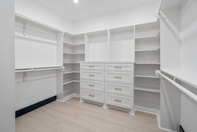 7831 Sandy St, Houston, TX 77028 - walk in closet with light wood-style floors