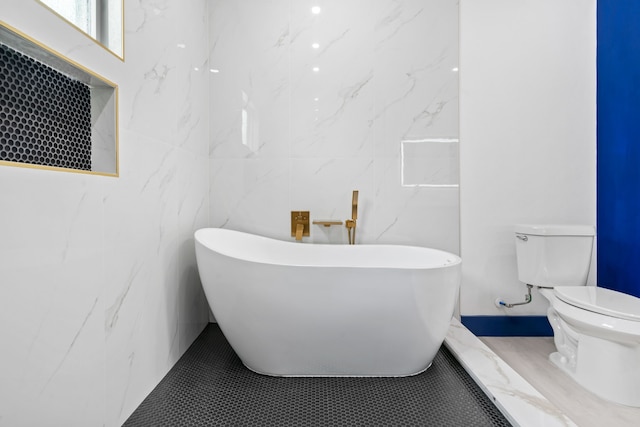 7831 Sandy St, Houston, TX 77028 - full bath featuring a freestanding tub and tile walls