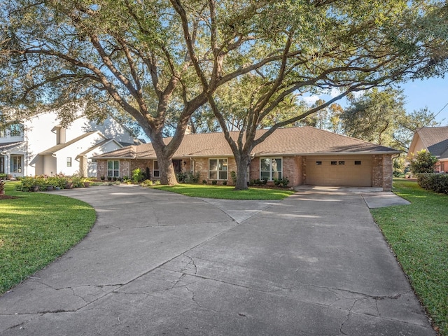 4710 Mckeever Ln, Missouri City, TX 77459 - single story home with driveway, an attached garage, a front lawn, and brick siding