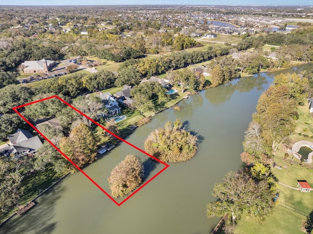 4710 Mckeever Ln, Missouri City, TX 77459 - aerial view of property and surrounding area with property boundaries highlighted, a large body of water, and nearby suburban area