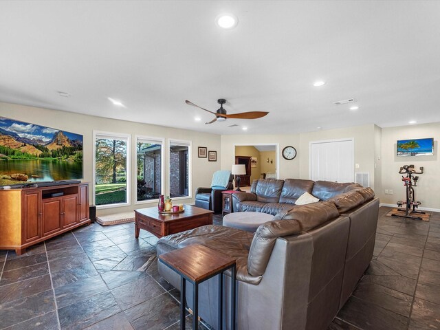 4710 Mckeever Ln, Missouri City, TX 77459 - living area with stone tile floors, a ceiling fan, and recessed lighting