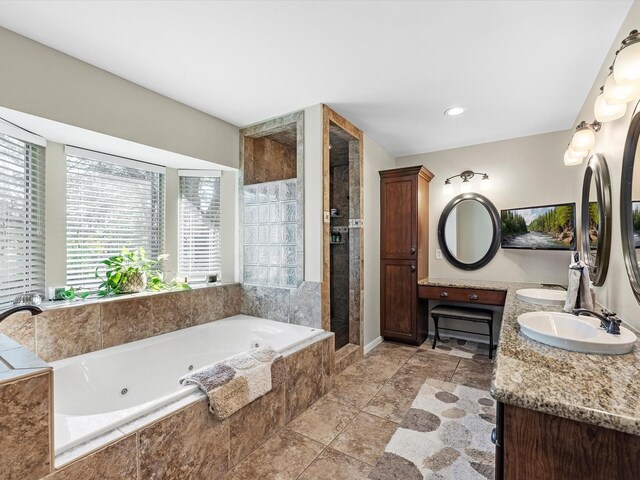 4710 Mckeever Ln, Missouri City, TX 77459 - bathroom with a whirlpool tub, double vanity, and a stall shower