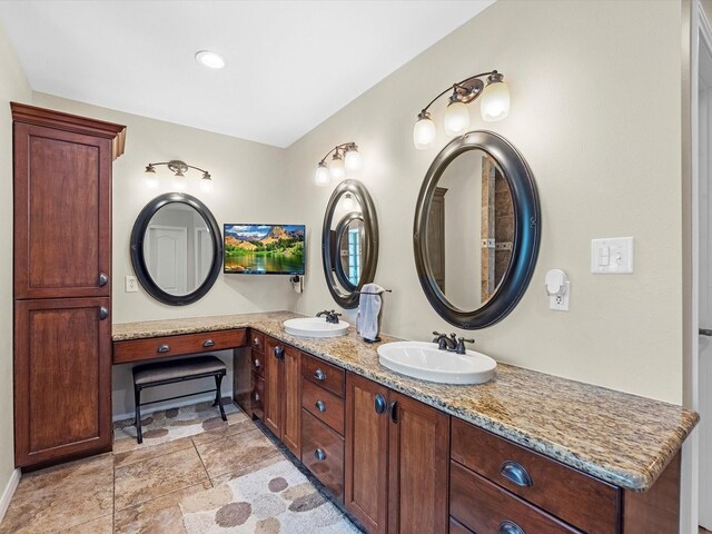 4710 Mckeever Ln, Missouri City, TX 77459 - bathroom featuring double vanity and stone finish flooring