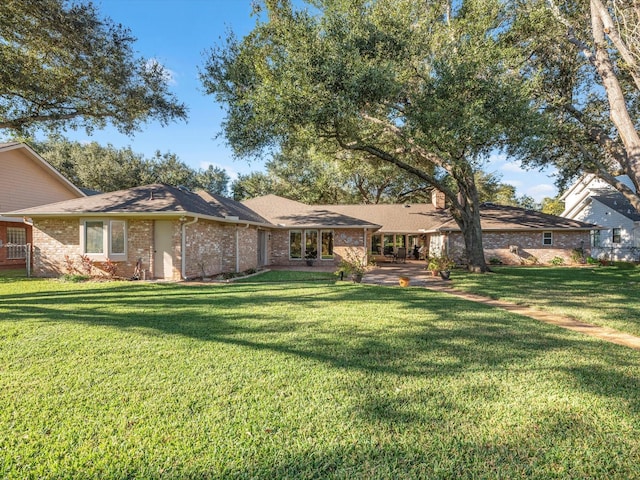 4710 Mckeever Ln, Missouri City, TX 77459 - view of front of home with a front lawn and brick siding