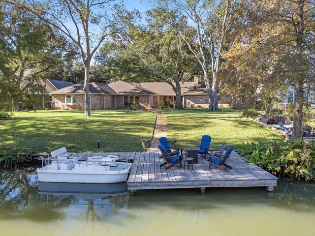 4710 Mckeever Ln, Missouri City, TX 77459 - dock area featuring a lawn and a water view