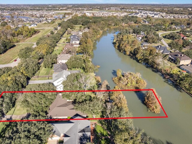 4710 Mckeever Ln, Missouri City, TX 77459 - aerial view of residential area featuring a large body of water and property parcel outlined