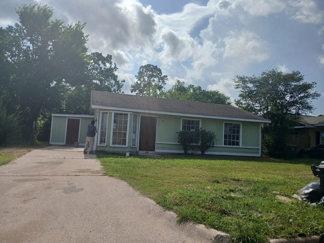 9711 Courben Ln, Houston, TX 77078 - single story home with concrete driveway and a front yard