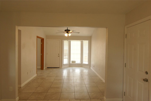 9711 Courben Ln, Houston, TX 77078 - unfurnished room featuring a ceiling fan and light tile patterned floors