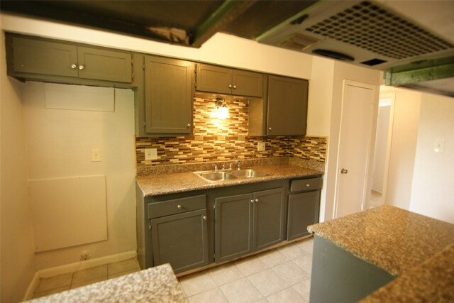 9711 Courben Ln, Houston, TX 77078 - kitchen with backsplash and light tile patterned flooring