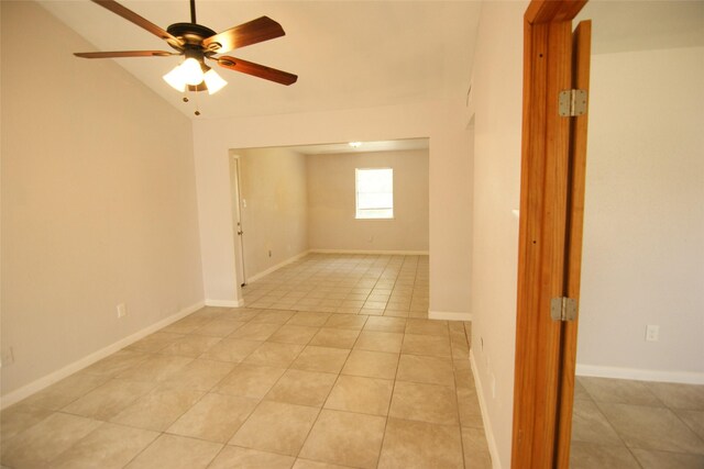 9711 Courben Ln, Houston, TX 77078 - empty room featuring ceiling fan, light tile patterned floors, and vaulted ceiling