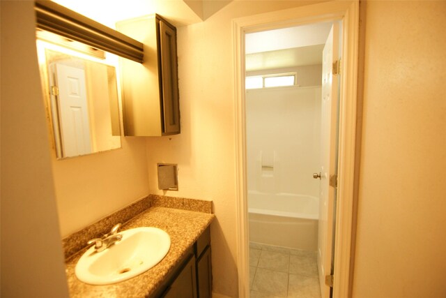 9711 Courben Ln, Houston, TX 77078 - full bathroom with vanity and tile patterned floors