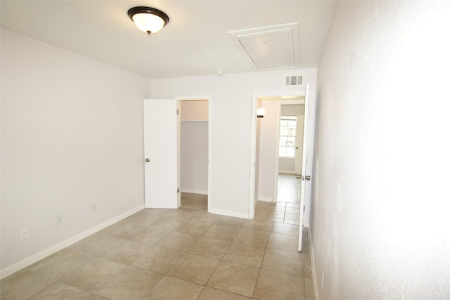 9711 Courben Ln, Houston, TX 77078 - unfurnished room with attic access and light tile patterned flooring