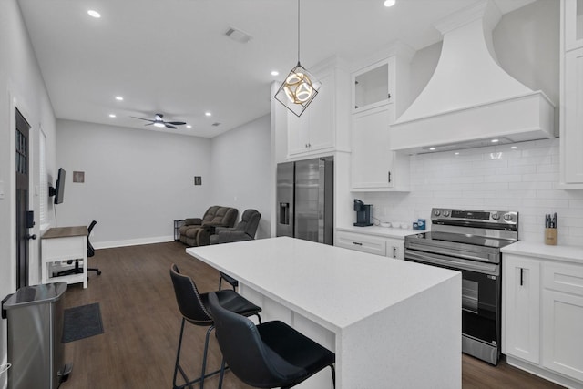 25446 Morgan Cemetery Rd, Cleveland, TX 77328 - kitchen with appliances with stainless steel finishes, premium range hood, open floor plan, decorative backsplash, and dark wood-style floors