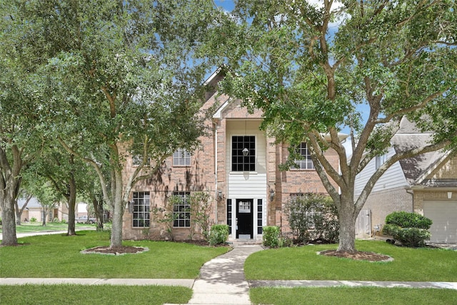 7823 Autumn Hollow Ln, Houston, TX 77041 - view of front of house featuring a front yard and brick siding