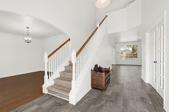 7823 Autumn Hollow Ln, Houston, TX 77041 - staircase featuring arched walkways, a high ceiling, a chandelier, and crown molding
