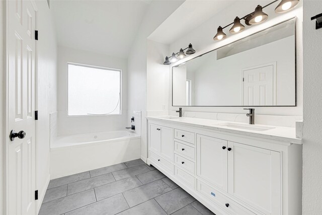 7823 Autumn Hollow Ln, Houston, TX 77041 - bathroom featuring double vanity, a bath, and tile patterned flooring