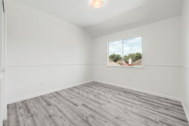 7823 Autumn Hollow Ln, Houston, TX 77041 - empty room with wood finished floors and vaulted ceiling