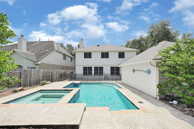 7823 Autumn Hollow Ln, Houston, TX 77041 - view of swimming pool featuring a fenced backyard, a pool with connected hot tub, and a patio