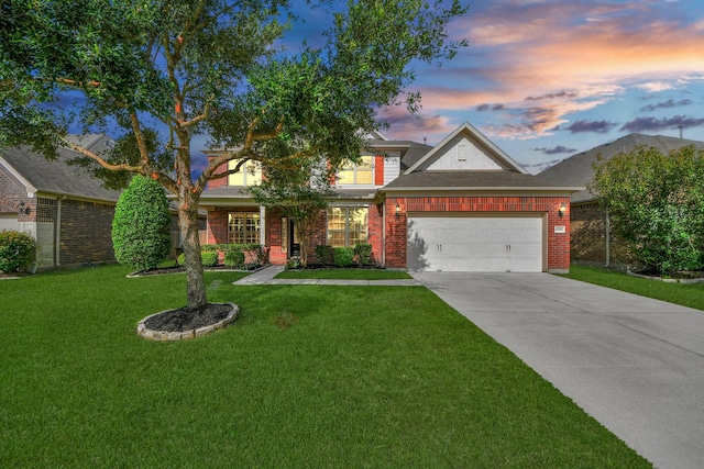 4330 Lasker Brook Ct, Katy, TX 77494 - view of front of home with a yard, driveway, a garage, and brick siding