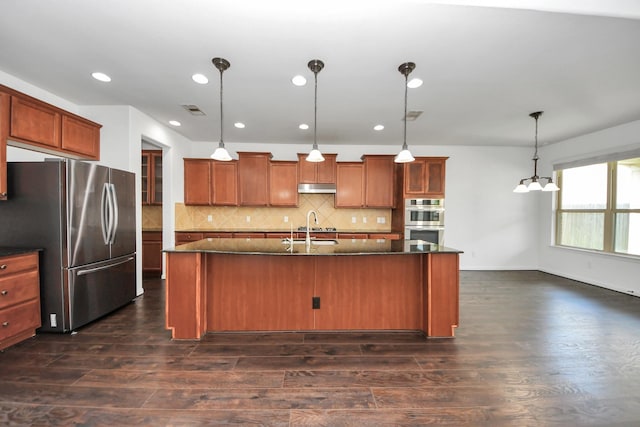 4330 Lasker Brook Ct, Katy, TX 77494 - kitchen with appliances with stainless steel finishes, under cabinet range hood, dark wood-style flooring, tasteful backsplash, and recessed lighting