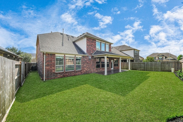 4330 Lasker Brook Ct, Katy, TX 77494 - rear view of property featuring brick siding, a fenced backyard, a patio, and roof with shingles