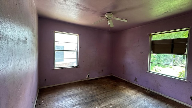 7218 Bretshire Dr, Houston, TX 77016 - unfurnished room featuring hardwood / wood-style floors, healthy amount of natural light, and ceiling fan