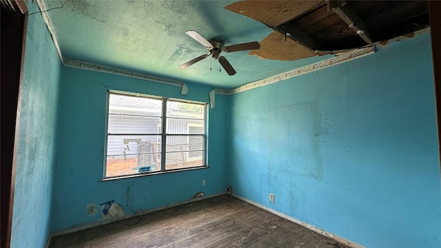 7218 Bretshire Dr, Houston, TX 77016 - empty room with wood finished floors, ceiling fan, and a textured ceiling