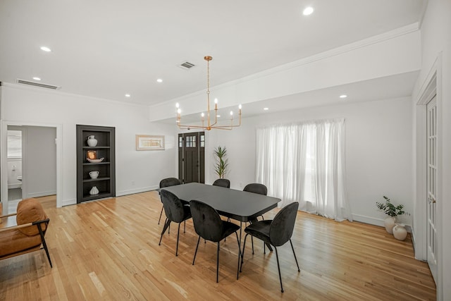 5630 Lymbar Dr, Houston, TX 77096 - dining room featuring built in shelves, ornamental molding, a chandelier, recessed lighting, and light wood finished floors