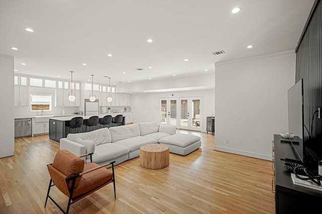5630 Lymbar Dr, Houston, TX 77096 - living area featuring recessed lighting, light wood finished floors, and ornamental molding