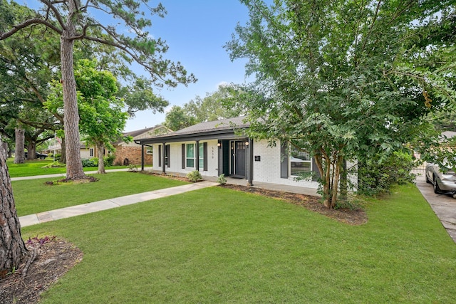 5630 Lymbar Dr, Houston, TX 77096 - ranch-style home with brick siding and a front lawn