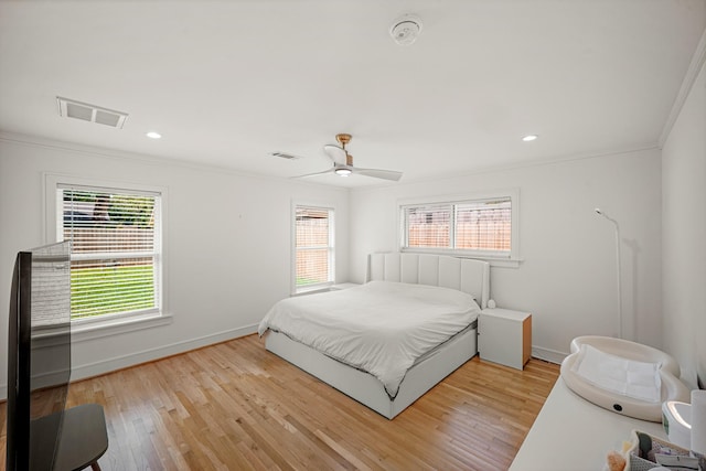 5630 Lymbar Dr, Houston, TX 77096 - bedroom featuring multiple windows, wood finished floors, ornamental molding, a ceiling fan, and recessed lighting
