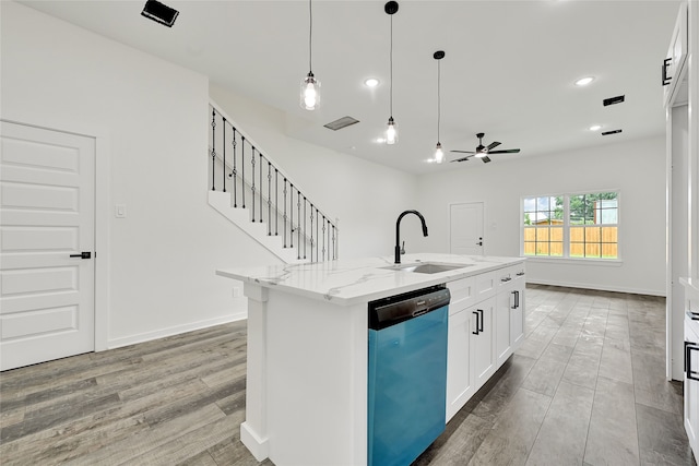 7922 Sealey St, Houston, TX 77088 - kitchen with dishwashing machine, ceiling fan, light stone counters, light wood finished floors, and pendant lighting