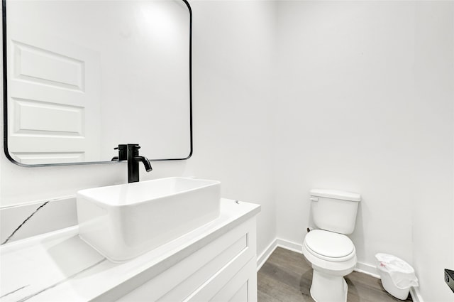 7922 Sealey St, Houston, TX 77088 - half bathroom with wood finished floors and vanity
