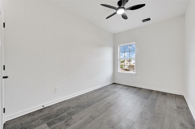 7922 Sealey St, Houston, TX 77088 - unfurnished room featuring a ceiling fan and dark wood-type flooring