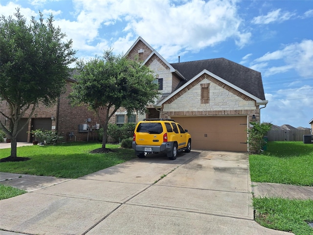 20331 Weeping Pine Way, Richmond, TX 77407 - view of front facade featuring stone siding, a front yard, concrete driveway, an attached garage, and a shingled roof