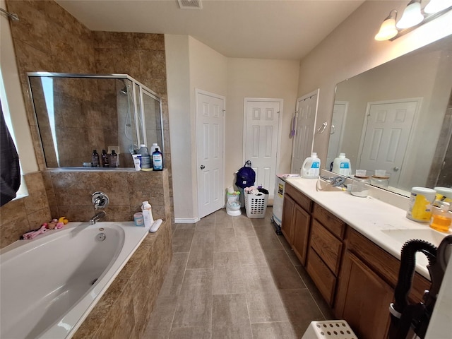 20331 Weeping Pine Way, Richmond, TX 77407 - bathroom with a stall shower, a bath, vanity, and tile patterned floors