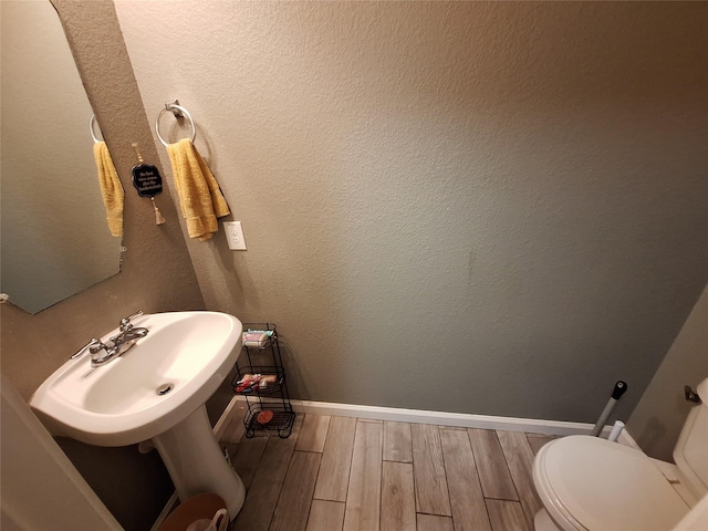 20331 Weeping Pine Way, Richmond, TX 77407 - bathroom with wood finished floors and toilet
