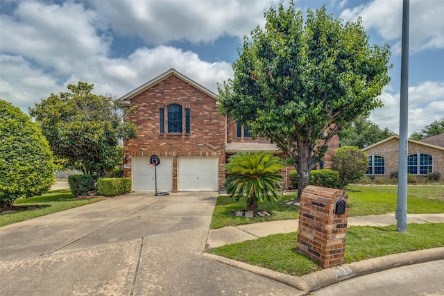 3038 Rainmont Ln, Katy, TX 77449 - view of front facade featuring brick siding, a garage, a front lawn, and concrete driveway