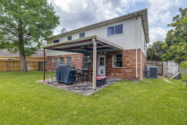 3038 Rainmont Ln, Katy, TX 77449 - back of property featuring brick siding, a patio, a fenced backyard, and a chimney