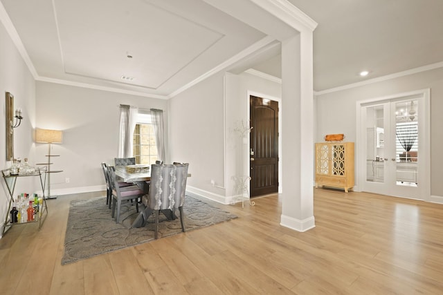 6919 Shoreline View Dr, Katy, TX 77493 - dining space featuring wood finished floors, ornamental molding, recessed lighting, and a raised ceiling