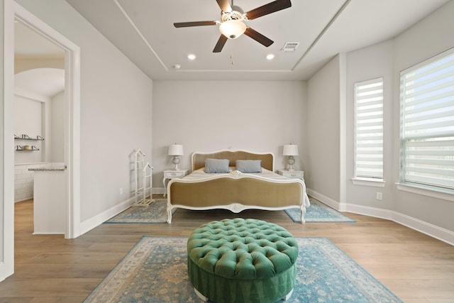 6919 Shoreline View Dr, Katy, TX 77493 - bedroom with wood finished floors, recessed lighting, ceiling fan, and arched walkways
