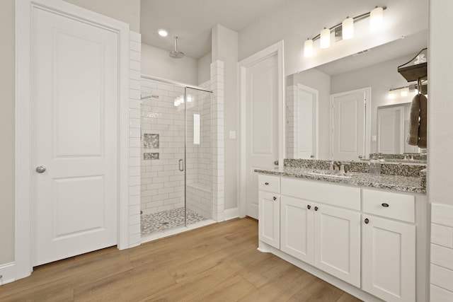 6919 Shoreline View Dr, Katy, TX 77493 - full bathroom with a shower stall, vanity, wood finished floors, and recessed lighting